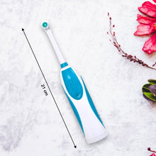 Electric toothbrush showing brushing head and handle.