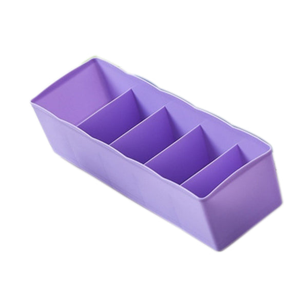 Clear plastic organizer tray with multiple compartments for bead storage.