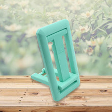 Mobile phone holder with adjustable height, foldable design