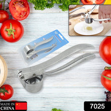 Close-up view of garlic press, showcasing its ergonomic design and aluminum material.