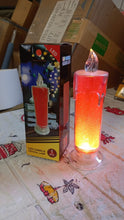 Close-up of the red LED candle, emphasizing its realistic and safe flame-like appearance.